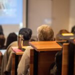 group-of-people-listening-to-speaker-2025-01-08-09-04-53-utc
