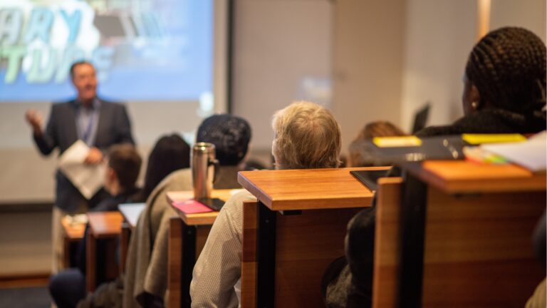 group-of-people-listening-to-speaker-2025-01-08-09-04-53-utc